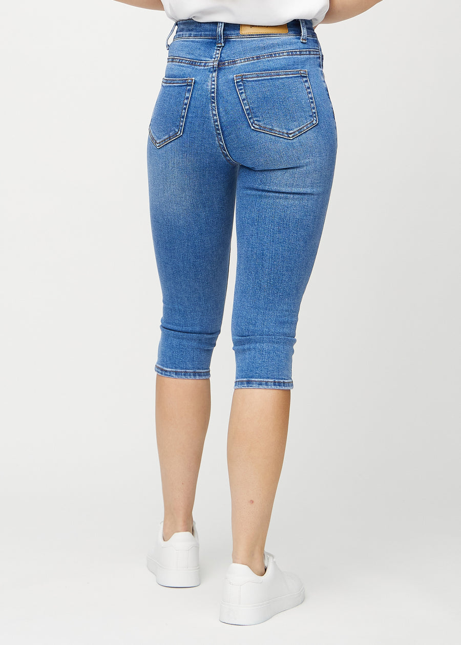 Denim skinny capris set bagfra, så man kan se hele produktet.